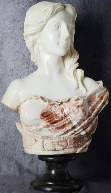ANTIQUE MARBLE BUST WOMAN W/ RED COLORED CLOAK: Antique marble bust of a woman. The woman herself is sculpted with white marble while her cloak is white and red marble, creating a striking contrast. Her face and hair are well realized. 90 lbs. Size