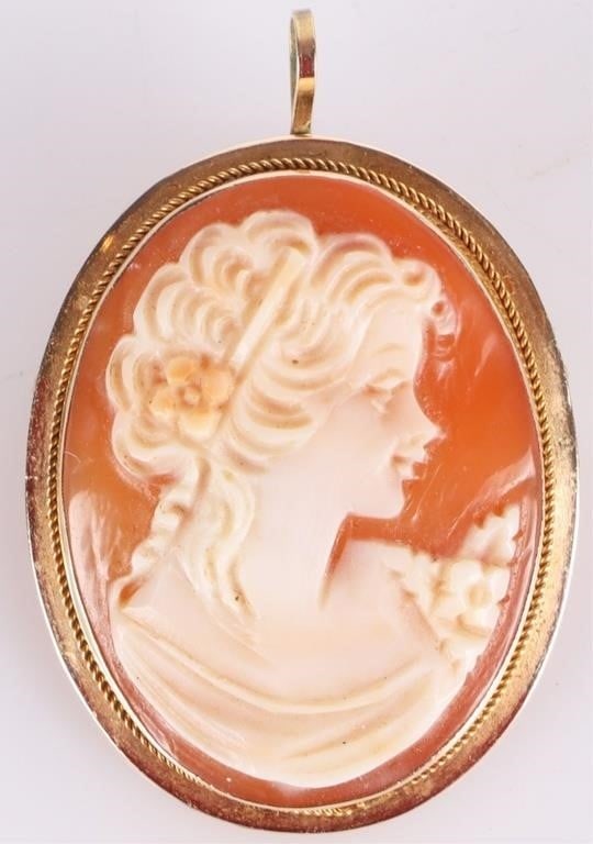 VINTAGE 14K YELLOW GOLD LADIES CAMEO PENDANT/ BROC: VIntage 14k yellow gold ladies pendant/brooch with a conch cameo which depicts the side profile of a Classically-styled woman with a painted flower in her hair. Weight: 3.33 grams total; ~1.5 grams go