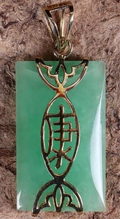 14K YELLOW GOLD GREEN JADE CHINESE PENDANT: 14K yellow gold green jade Chinese pendant. Gemstones to include one 25.00mm X 15.00mm rectangular cabochon jade. Stone Type: Jade Weight: 3.70 Grams Size: 1.375" Condition: Little to no wear, see ima