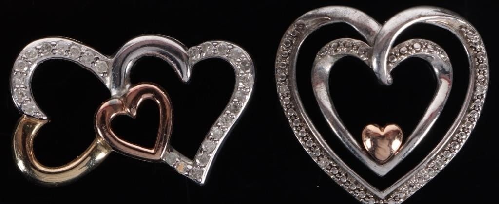14K WHITE/ROSE GOLD LADIES HEART PENDANTS W DIA(2): Lot of two 14k white/yellow gold ladies heart pendants. one features three layers of hearts, two outer white gold hollow hearts and a solid rose gold heart nestled at the base of the inner white gold 