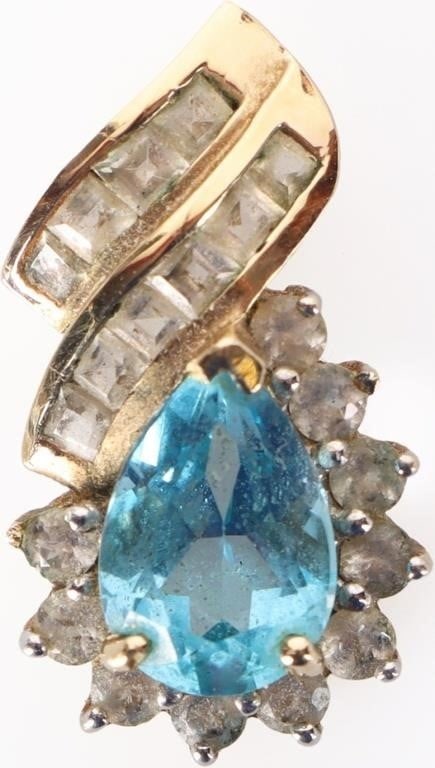 10K YELLOW GOLD LADIES PENDANT W/ 1.25CT TOPAZ: 10k yellow gold ladies pendant with an approximately 1.25ct pear-cut topaz center gemstone surrounded by diamond simulants. Stone Type: Topaz Weight: 2.67 grams Size: 22.38 x 12.3 mm Condition: See pi