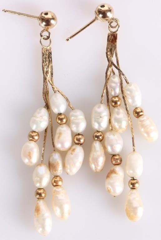 14K YELLOW GOLD DANGLE EARRINGS W/ BAROQUE PEARLS: Pair of 14k yellow gold ladies dangle stud earrings, each of which feature five dangling chains with two white baroque pearls. Stone Type: Pearl Weight: 2.71 grams Size: 47.3 x 8.25 mm Condition: See 