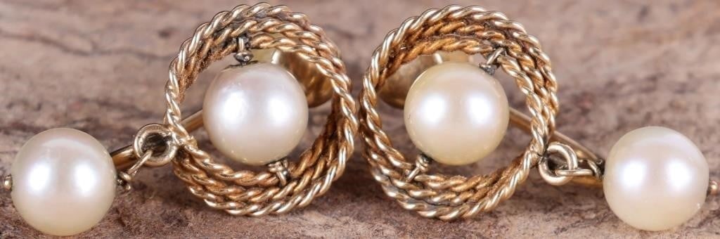 14K YELLOW GOLD LADIES EARRINGS W/ GENUINE PEARLS: Pair of 14k yellow gold ladies earrings with two genuine 6.5mm diameter pearls each, one set on the earring and another dangling. The set pearl is surrounded by a ropework design. Stone Type: Pearl We