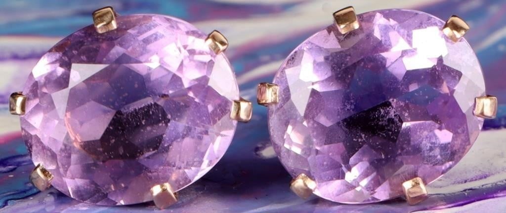 6CTW SPINEL 14K YELLOW GOLD LADIES EARRINGS: Pair of 14k yellow gold ladies earrings, each of which feature a 3ct oval-cut purple spinel gemstone. Stone Type: Spinel Weight: 3.03 grams Size: 12.35 x 11.4 mm each Condition: See pictures.