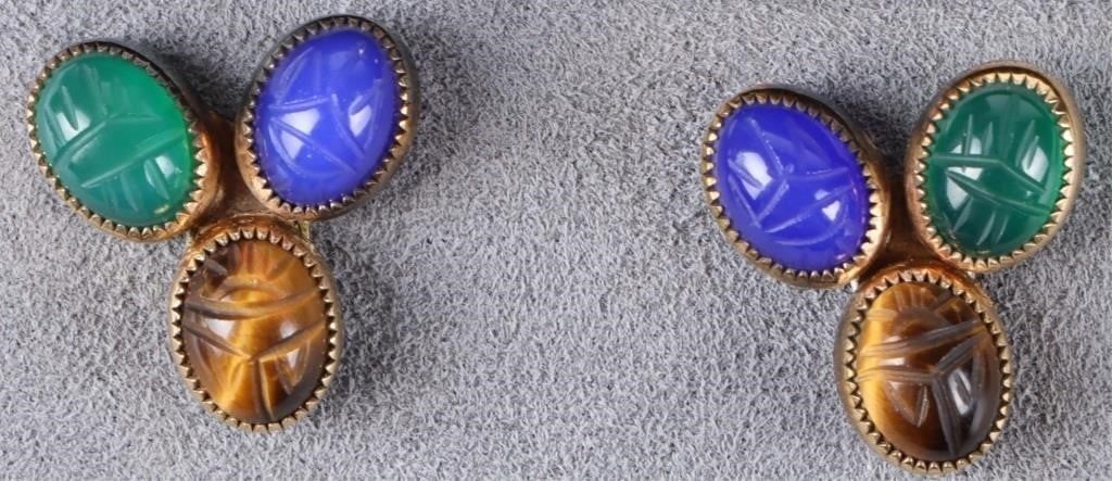 14K YELLOW GOLD LADIES EARRINGS W/ TIGERS EYE ETC: 14k yellow gold ladies earrings designed to resemble a clover. Each piece features a tigers eye stone, a blue stone, and a blue stone, which in turn feature carvings on their surface. Stone Type: Tige