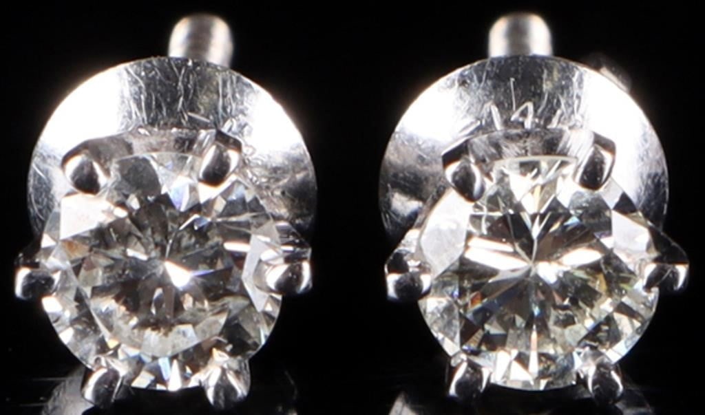 14K WHITE GOLD NATURAL DIAMOND LADIES EARRINGS: 14K white gold natural diamond ladies earrings. Gemstones to include one 0.33ct round cut natural diamond per each earring. Stone Type: Diamond Size: 0.675" Condition: Little wear, see images for deta
