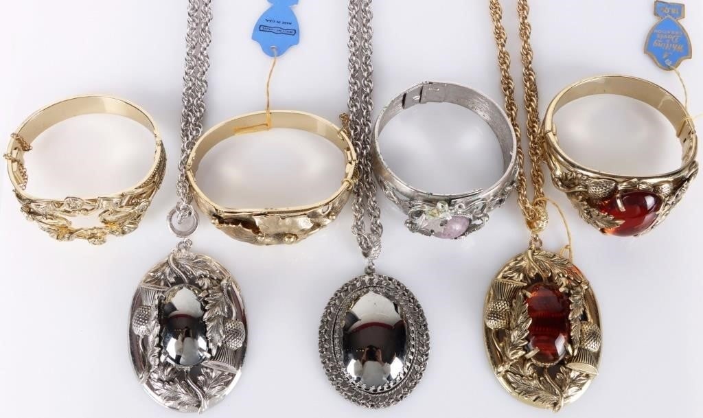 WHITING & DAVIS ORNATE NECKLACES/BRACELETS - (7): Whiting & Davis ornate necklaces/ bracelets to include one amber themed matching bracelet and necklace set, two silver toned necklaces, one purple marbled silver toned bracelet and two gold toned