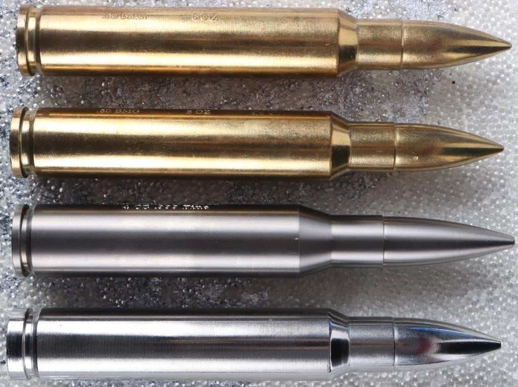 AMMOBULLION 4-8OZ METAL BULLET ROUND BULLION - (4): Ammobullion 4-8 ounce metal bullet round bullion to include two 8oz copper bullet rounds, one 4oz titanium bullet round, and one 8oz stainless steel bullet round. Weight: 793.787 Grams Condition: Litt