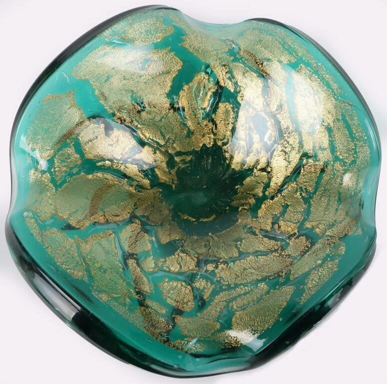 ITALIAN MURANO GOLD & GREEN BOWL: Italian Murano gold and green glass dust bowl. This bowl is in a very unique shape. Perfect for jewelry. Size: 2.5" x 6.5" Condition: No cracks, chips or signs of repair. See images for complete condi