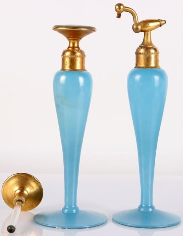 ANTIQUE DEVILBISS BLUE PERFUME ATOMIZER & DROPPER: Set of two blue and gold antique DeVilbiss perfume bottles, to include one atomizer and one dropper. Also includes an extra dropper. Size: Approximately 6 x 2.25" each Condition: The extra dropper suf