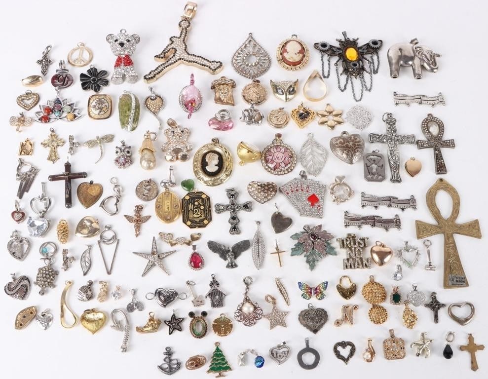 1.5 LB ASSORTED WOMENS & MENS PENDANT LOT: This lot contains 1.5 LBS of assorted women's & men's pendants. there are many different styles and designs. Some of the designs include, hearts, flowers, cameos, crucifixes and animals. Weight: 1.5 L