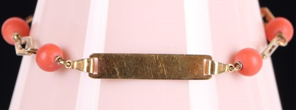18K YELLOW GOLD LADIES BRACELET W/ CORAL BEADS: 18k yellow gold ladies bracelet with six round coral beads, five diamond-shaped links, and a plain rectangular face on which a name or phrase can be stamped. Stone Type: Coral Weight: 3.41 grams Size: