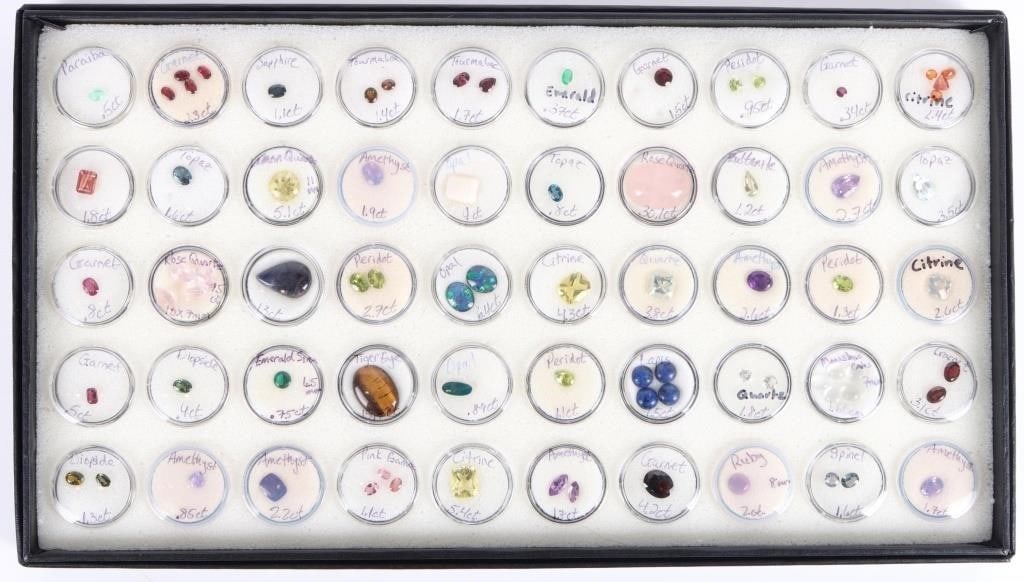 ~100CTW LOOSE ASSORTED SEMI-PRECIOUS GEMSTONES: ~100CTW loose assorted semi-precious gemstones to include sapphire, tourmaline, emerald, quartz, citrine, amethyst, lapis, topaz, garnet, peridot, opal, and more. 50 capsules total. Stone Type: Assort