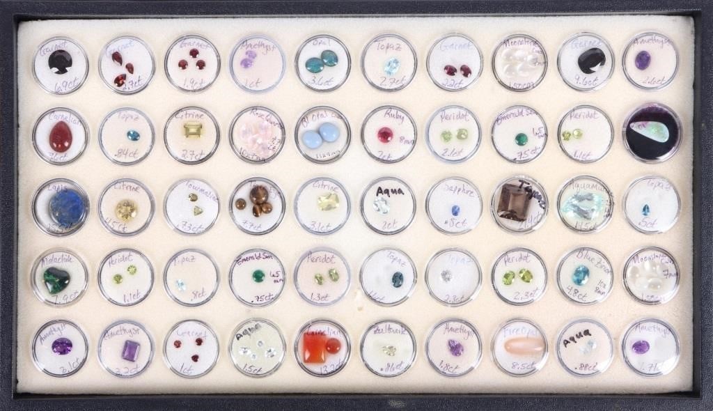 ~100CTW LOOSE ASSORTED SEMI-PRECIOUS GEMSTONES: ~100CTW loose assorted semi-precious gemstones to include sapphire, tourmaline, emerald, quartz, citrine, amethyst, lapis, topaz, garnet, peridot, opal, and more. 50 capsules total. Stone Type: Assort