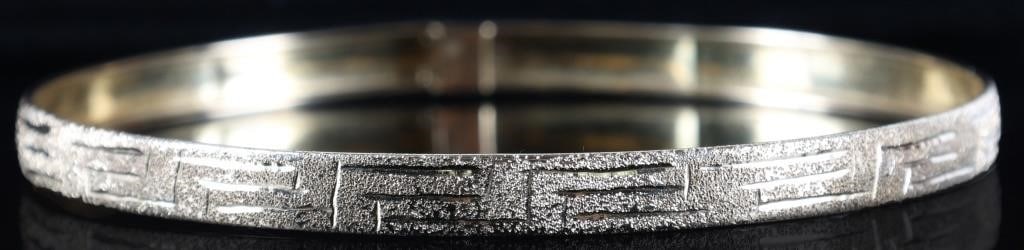 14K YELLOW GOLD LADIES BRACELET GREEK MEANDER: 14k yellow gold ladies bracelet. The surface is textured to catch light and sparkle when tilted. Etched along its length is a Greek meander design. Goes well with Art Deco pieces found elsewhere in th