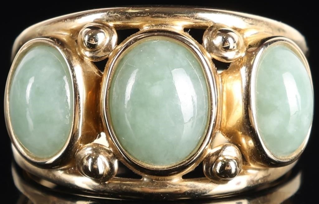 14K YELLOW GOLD JADEITE PRETTY LADIES RING: 14K yellow gold pretty ladies past present and future ring featuring a 1.5CT oval jadeite center cabochon and two 1.0CT oval jadeite cabochons. Stone Type: Jade Weight: 4.56 Grams Size: 8.75 U.S Condi