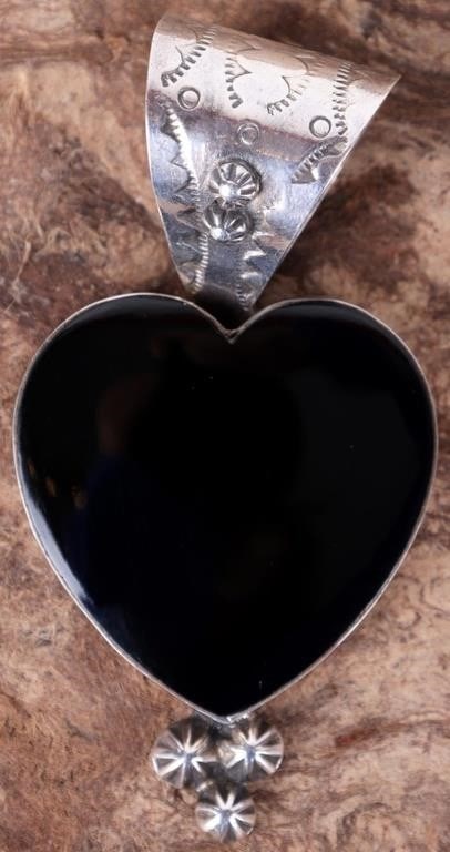 DAN DODSON STERLING BLACK ONYX HEART PENDANT: Dan Dodson sterling silver pendant with large black onyx heart. This pendant has a wide bail with hand stamped details with star beading. There are 3 star bead accents on the bottom of the heart. Ston