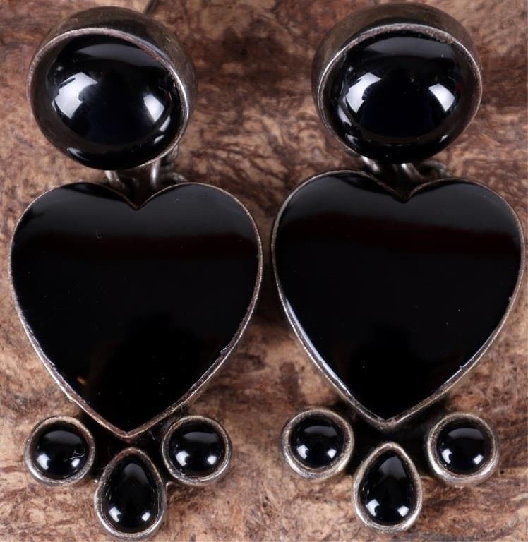 VINTAGE DAN DODSON BLACK ONYX HEART EARRINGS: Vintage Dan Dodson sterling silver earrings that feature a heart shaped centerpiece made of black onyx. Hanging below the heart are 3 small, round black onyx bezel set in silver creating a dangling " 