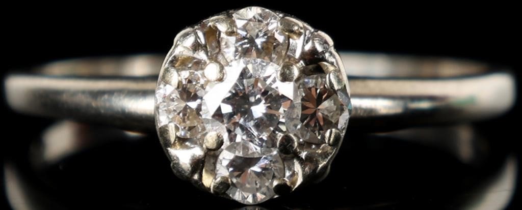 14K WHITE GOLD LADIES CLUSTER ENGAGEMENT RING: 14K white gold ladies cluster engagement ring. The center diamond is 0.25CT surrounded by four 0.04CT round cut diamonds creating the look of a larger diamond. Stone Type: Diamond Weight: 2.47 Grams S