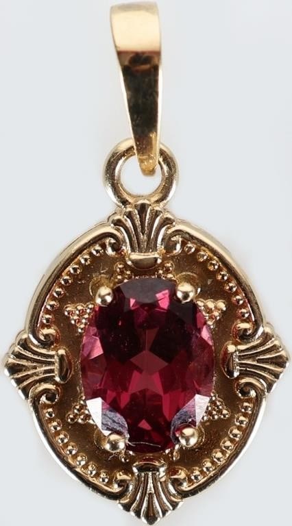 14K YELLOW GOLD LADIES PENDANT W/ TOURMALINE: Ornate 14k yellow gold ladies pendant with a 1.25ct oval-cut tourmaline center gemstone. Stone Type: Tourmaline Weight: 2.4 grams Size: 24.15 x 13.23 mm Condition: See pictures.