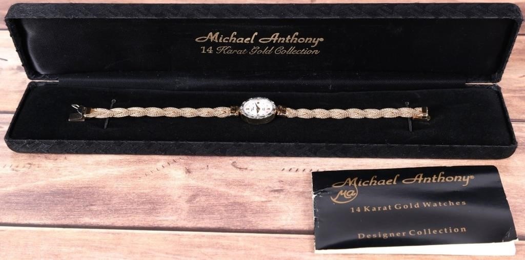 14K GOLD MICHAEL ANTHONY LADIES WRIST WATCH W/ DIA: Michael Anthony ladies wrist watch. The piece is composed of a shimmering 14k yellow gold braided band, a 14k yellow gold case, a 14k white gold etched bezel with 0.01ct round-cut diamonds aligned wit