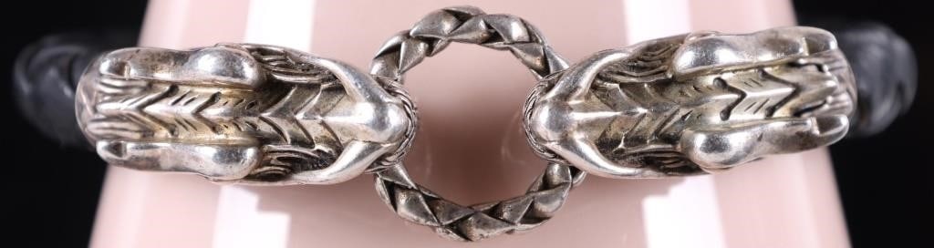 JOHN HARDY NAGA DRAGON STERLING LEATHER BRACELET: John Hardy Legends Naga Double Dragon sterling silver black leather bracelet. Stone Type: Sapphire Weight: 27.77 Grams Size: 7.25 U.S. Condition: Some wear, see images for details.