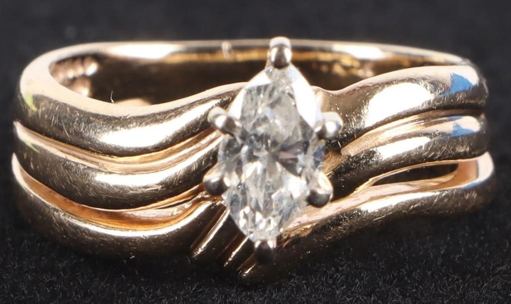 0.5CT MARQUISE DIAMOND SOLITAIRE 14K LADIES RING: 0.5CT marquise cut diamond solitaire ladies ring set in 14K yellow gold. The band has a wave design adding more elegance to the ring. Stone Type: Diamond Weight: 5.29 Grams Size: 7.0 Condition: Please