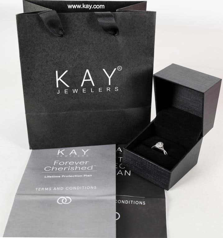 14K WHITE GOLD NATURAL DIAMOND LADIES RING IN BOX: 14K white gold natural diamond ladies ring in original Kay box. Gemstones to include one 0.10ct oval cut natural diamond, ten 0.01ct round cut diamonds, and sixty-eight 0.005ct round cut diamonds. Sto