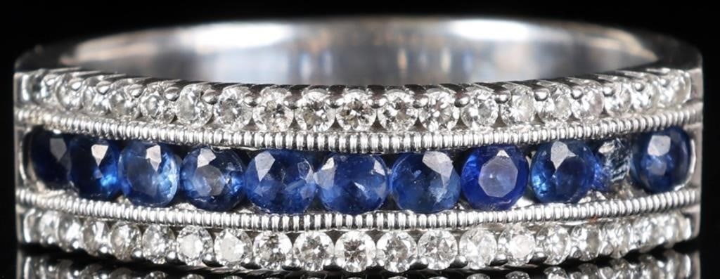 38 DIAMONDS 11 TOPAZ 14K WHITE GOLD MENS RING: 14k white gold mens ring with eleven 0.04ct round-cut topaz gemstones along the face and thirty-eight 0.01ct round-cut diamonds flanking them (nineteen above and below). Signed 'Stefi'. Stone Type: Di