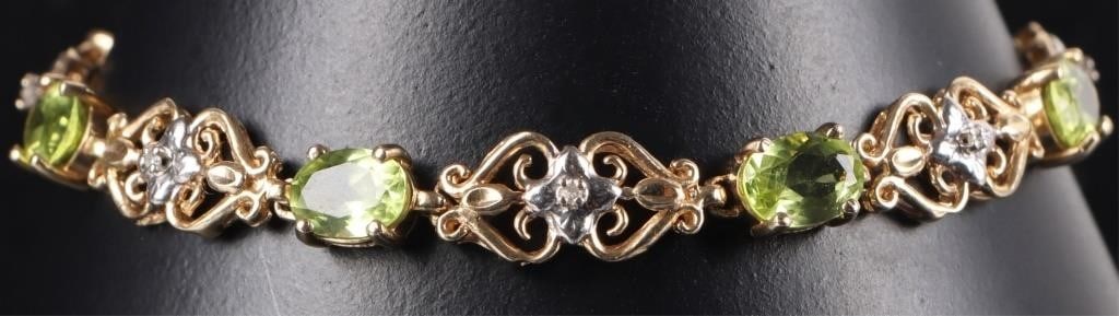 14K YELLOW GOLD PERIDOT DIAMOND LADIES BRACELET: 14K yellow gold peridot diamond ladies bracelet. Gemstones to include seven 0.50ct oval cut peridot and seven 0.01ct round cut diamonds. Stone Type: Assorted Weight: 8.11 Grams Size: 7.00" Condition: 