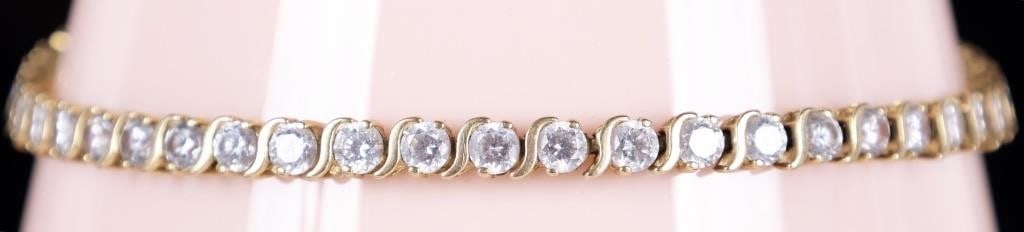 14K YELLOW GOLD LADIES BRACELET W/ RHINESTONES: 14k yellow gold ladies bracelet lined with bright white rhinestones across its length. Stone Type: Rhinestone Weight: 7.58 grams Size: 8" long Condition: See pictures.