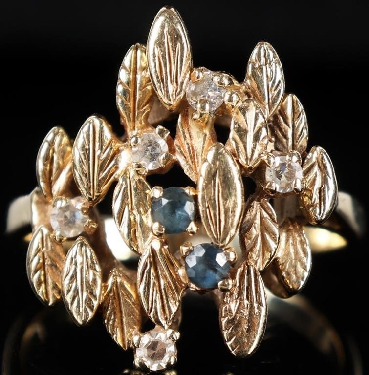 14K YELLOW GOLD DIAMOND SAPPHIRE LEAF LADIES RING: 14K yellow gold diamond sapphire carved leaf ladies ring. Gemstones to include two 0.04ct round cut blue sapphire, and five 0.04ct round cut diamonds. Stone Type: Assorted Weight: 8.19 Grams Size: 8.7