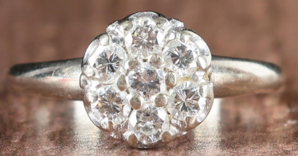 14K WHITE GOLD LADIES RING W/ 7-DIAMOND ROSETTE: 14k white gold ladies ring with seven 0.07ct round-cut diamonds arranged in a rosette on the face. Stone Type: Diamond Weight: 3.37 grams Size: US 6.25 Condition: See pictures.