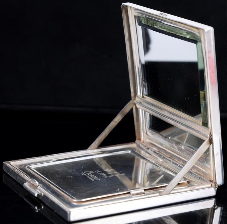 DUNHILL STERLING SILVER LADIES COMPACT WITH MIRROR: Dunhill Clearview sterling silver ladies compact with mirror. When opened there is a mechanism that cleans off the mirror. Weight: 137.58 Grams Size: 2.75" x 2.75" Condition: Slight surface scratches