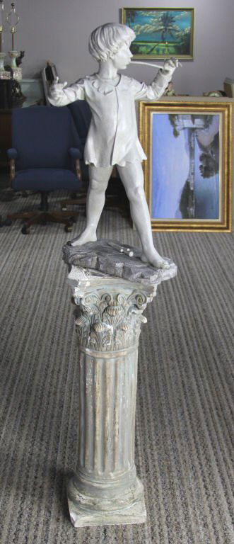 COMPOSITE PETER PAN STATUE ON PLASTER PEDESTAL: COMPOSITE PETER PAN STATUE ON PLASTER PEDESTAL Statue 29.5", pedestal 36" Shipping / Pickup: Buyer Can Pick This Item Up or It Can Ship 3rd Party Lot Location: #3 - Off Cap. Cir. NE