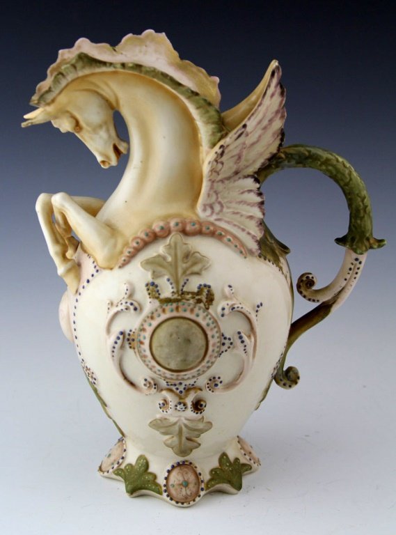 VINTAGE PORCELAIN PEGASUS PITCHER: VINTAGE PORCELAIN PEGASUS PITCHER Vintage porcelain Pegasus pitcher. Design on the pitcher consists of acanthus and leaf designs. Marked RW to base. Size: 10.5 x 8" Shipping / Pickup: We Can Ship This