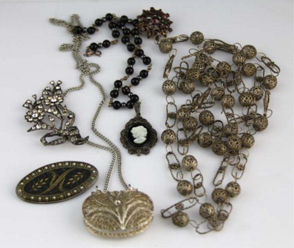 LADIES VINTAGE SILVER AND COSTUME JEWELRY: LADIES VINTAGE SILVER AND COSTUME JEWELRY Ladies silver filigree purse pendant with chain; ladies silver filigree beads; vintage rhinestone sterling floral pin; sterling marcasite cameo beaded necklac