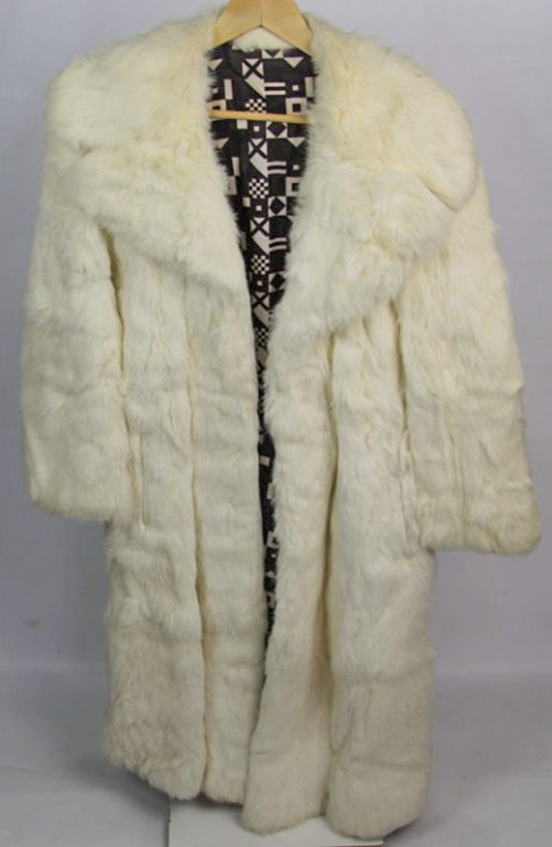 FULL LENGTH WHITE RABBIT COAT: FULL LENGTH WHITE RABBIT COAT Ladies full length white rabbit coat . Creamy white color, Silk lining with minor stain on inside not monogrammed Size: 4-7 Lot Location: #1 - Manor'sGallery