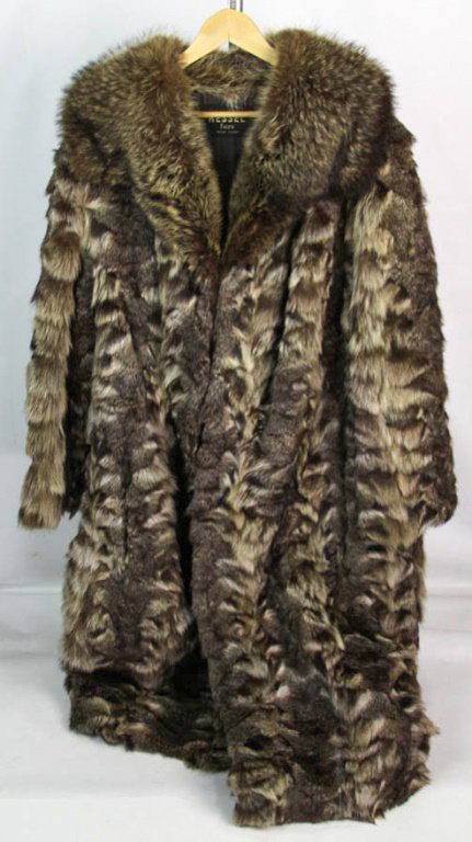 HESSEL LADIES RACCOON FUR FULL LENGTH COAT: HESSEL LADIES RACCOON FUR FULL LENGTH COAT 48" nape to tail, 26" arm, 16" at shoulders. Shipping / Pickup: We Can Ship This Item Lot Location: #1 - Manor's Gallery