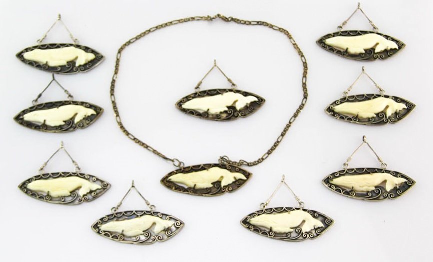 LOT OF TEN STERLING SILVER & BONE WHALE PENDANTS: LOT OF TEN STERLING SILVER & BONE WHALE PENDANTS Made in Indonesia, all pieces are marked. One includes chain. Weight: 140.6g total Shipping / Pickup: We Can Ship This Item Lot Location: #1 - Manor's 