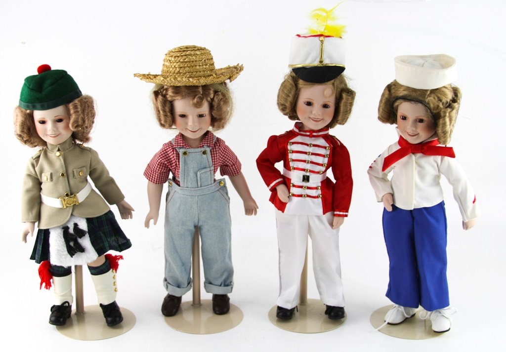 LOT OF FOUR DANSBURY MINT SHIRLEY TEMPLY DOLLS: LOT OF FOUR DANSBURY MINT SHIRLEY TEMPLY DOLLS Porcelain and cloth, includes stands. Size: ~14" Shipping / Pickup: Buyer Pick Up, 3rd Party Lot Location: #1 - Manor's Gallery