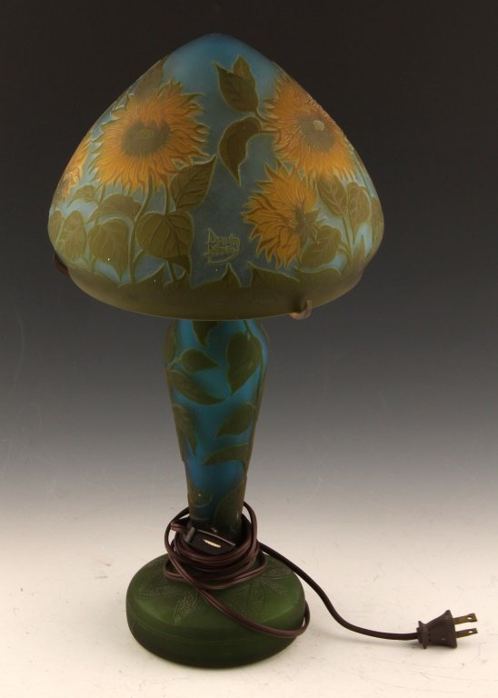 REPRODUCTION DAUM CAMEO GLASS SUNFLOWER LAMP: REPRODUCTION DAUM CAMEO GLASS SUNFLOWER LAMP Blue and yellow sunflower motif. Size: 17" Shipping / Pickup: Buyer Pick Up, 3rd Party Lot Location: #1 - Manor's Gallery
