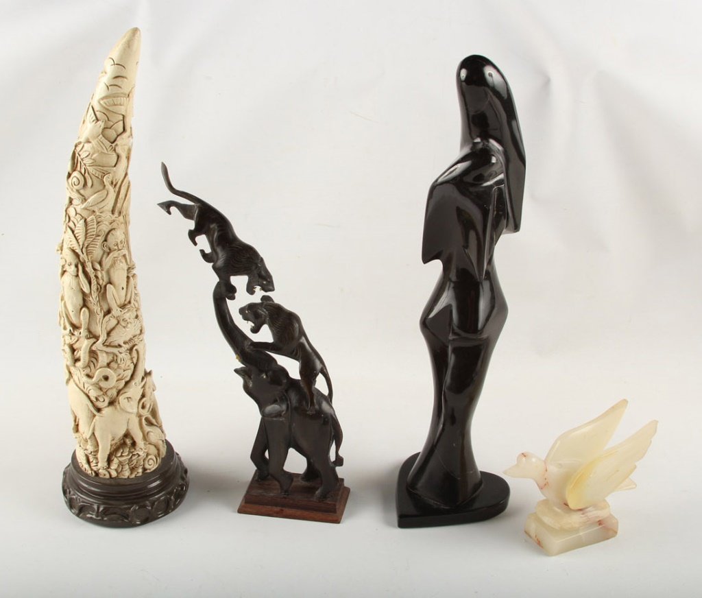 LOT - CARVED WATER BUFFALO HORN, COMPOSITE TUSK: LOT - CARVED WATER BUFFALO HORN, COMPOSITE TUSK A lot to contain: Brown / black modernist carved hard stone statue (16"), A nicely carved water buffalo horn in the form of an elephant and 2 attacking 