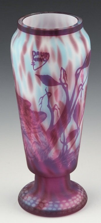 REPRODUCTION DAUM CAMEO GLASS KOALA MOTIF VASE: REPRODUCTION DAUM CAMEO GLASS KOALA MOTIF VASE Reproduction Daum cameo glass koala motif vase with purple over a striated base. Size: 10.5" Shipping / Pickup: Buyer Pick Up, 3rd Party Lot Location: #1