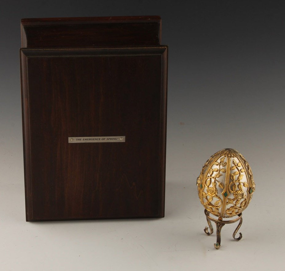 FRANKLIN MINT EMERGENCE OF SPRING STERLING EGG: FRANKLIN MINT EMERGENCE OF SPRING STERLING EGG The egg is solid sterling silver with gold electroplate and malachite accents and flower motif. The interior of the egg has a 6.6g 18K yellow gold bumble