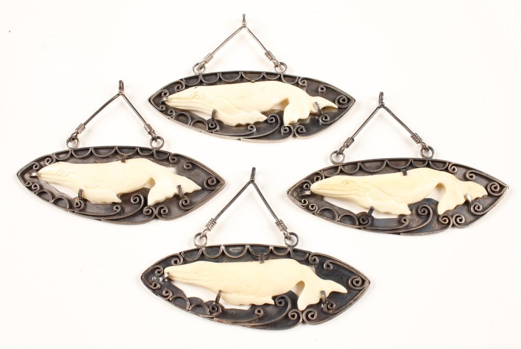 FOUR STERLING AND BONE WHALE PENDANTS: FOUR STERLING AND BONE WHALE PENDANTS Includes four sterling pendants with a whale carved from bone in the center. Weight: 50.9g total Shipping / Pickup: We Can Ship This Item Lot Location: #1 - Manor