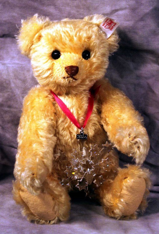 Steiff Bear: Steiff Bear "Daniel-The Swarovski Teddy Bear" light Blond, 10" L. Ed. 228/2004 no. 667718, includes Swarovski Xilion Stone as button in ear and a Swarovski Holiday Ornament w/ red ribbon