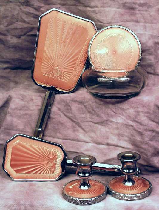 China/Glassware: 6 Piece Art Deco vanity Set w/ Enamel Rose Backing; Powder Brush, Reflector, Hair Receiver, and rare to find Candle Sticks. Circa 1930-1940.
