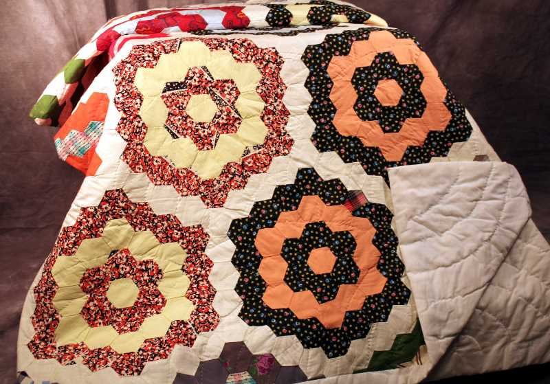 Textiles: Quilt, hand sewn, 88"x68", Grandmother's Flower Garden Pattern, trimmed and backed with white material