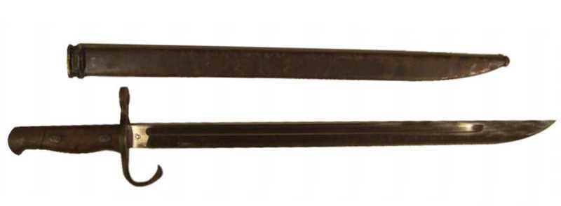 Japanese Arisaka Bayonet w/ Sheath: Type 30 bayonet for Arisaka Type 38/99 rifles, contoured wood grips, birds head pommel and a metal scabbard. Marked on the blade with a circle symbol and # 2542407 Total length is approx. 22.75"
